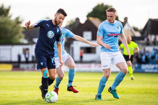 Erdal Rakip of Malmö FF and Andrew Burns of Ballymena