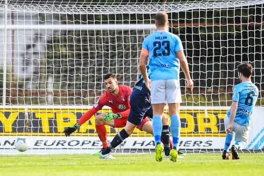 Ryan Mayse of Ballymena United and goalkeeper Dusan