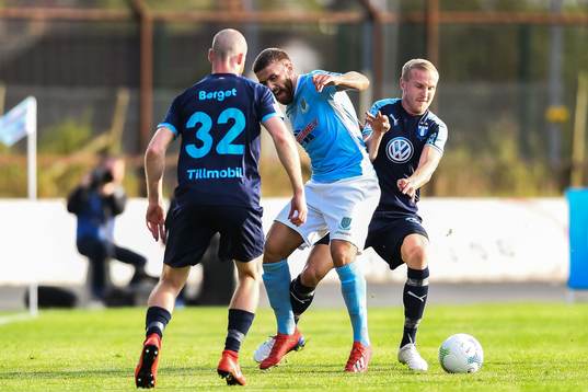 Franz Brorsson of Malmö FF and Steven McCullough of