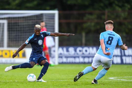Bonke Innocent of Malmö FF and Ryan Harpur of Ballymena