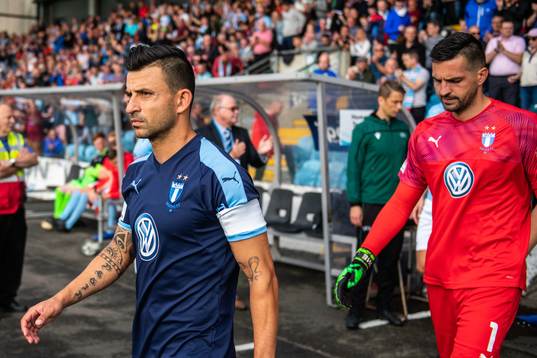 Behrang Safari and goalkeeper Dusan Melicharek of Malmö FF