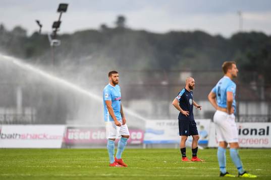 Jo Inge Berget of Malmö FF when the sprinkler sprays water