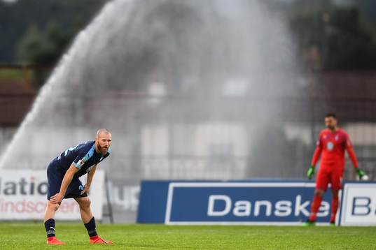 Jo Inge Berget of Malmö FF when the sprinkler sprays water