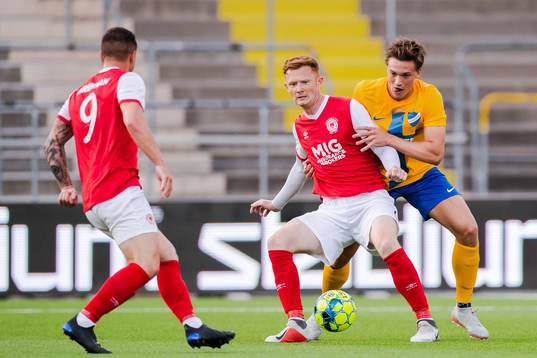 Gary Shaw of St Patrick's and Rasmus Lauritsen of IFK