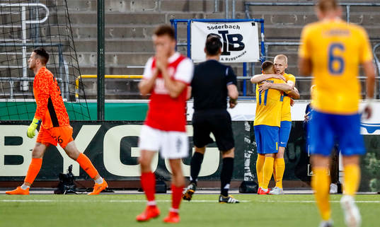 of St Patrick's players look dejected and Kalle Holmberg of