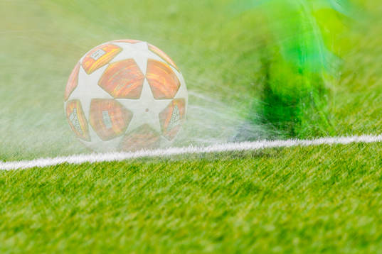 The Adidas match ball is being kicked