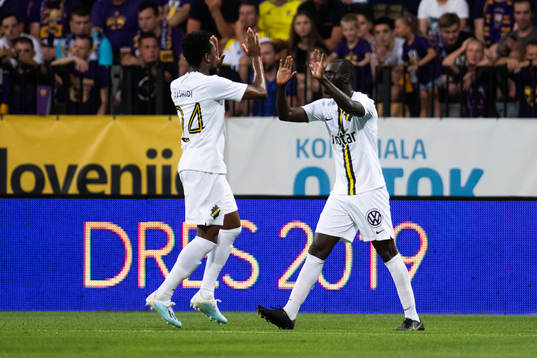 Heradi Rashidi and Enoch Kofi Adu celebrate