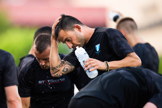 Behrang Safari of Malmö FF with water dripping from his