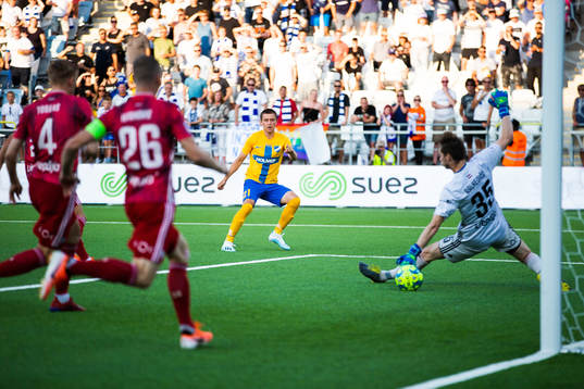 Simon Thern of IFK Norrköping scores 1-0 behind goalkeeper