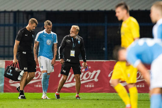 Sören Rieks of Malmö FF is attended to by the medical