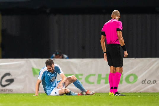 Lasse Nielsen of Malmö FF sits down du to injury