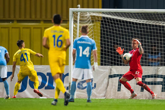 Adam Gnezda of Domzale with an attempt against goalkeeper