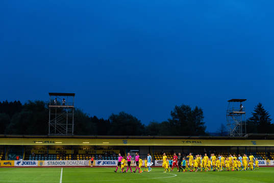 Players of Domzale and of Malmö FF enters the pitch