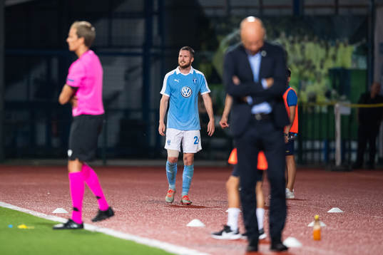 Lasse Nielsen of Malmö FF leaves the pitch due to injury