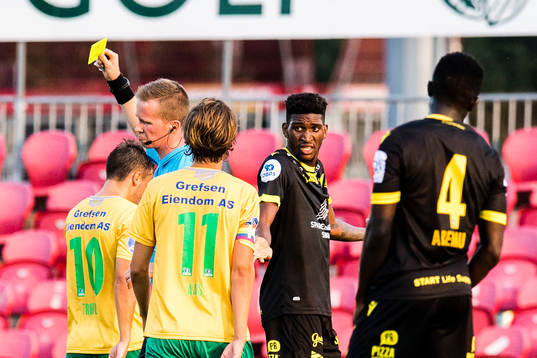 Damion Lowe of Start gets a yellow card