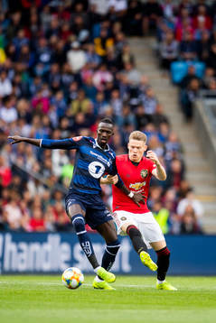 Amidou Diop of Kristiansund and Scott McTominay of