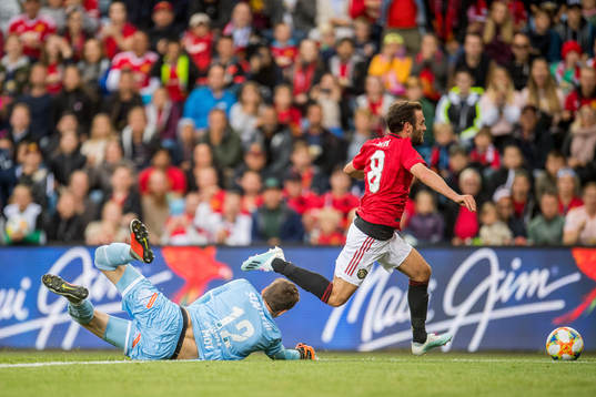 Goalkeeper Andreas Vaikla of Kristiansund and Juan Mata of