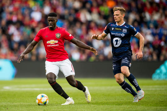 Axel Tuanzebe of Manchester United and Meinhard Olsen of