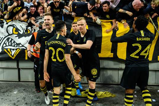 Tarik Elyounoussi of AIK celebrates with teammates