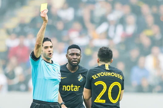Tarik Elyounoussi of AIK gets a yellow card