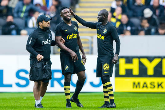 Chinedu Obasi of AIK leaves the pitch with an injury