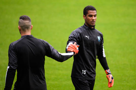 Goalkeeper Lamin Sarr and goalkeeper Dusan Melicharek of
