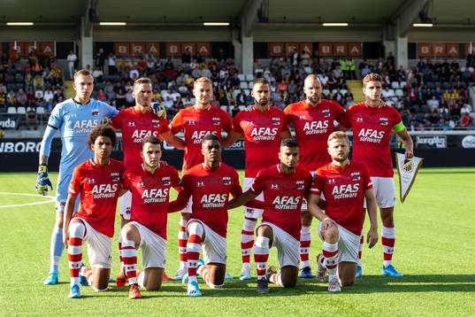 Players of AZ Alkmaar pose for a team group photo