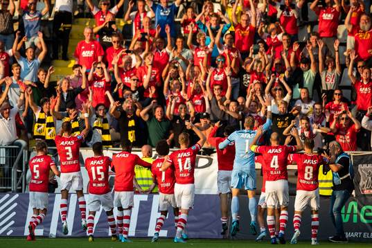 Players of AZ Alkmaar celebrate with supporters
