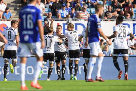 Mike Jensen of Rosenborg celebrate with teammates