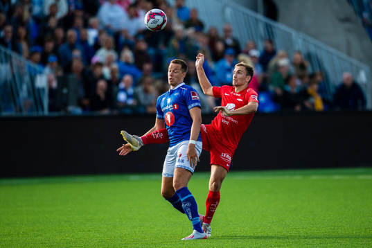 Michael Karlsen of Ranheim and Amer Ordagic of Brann