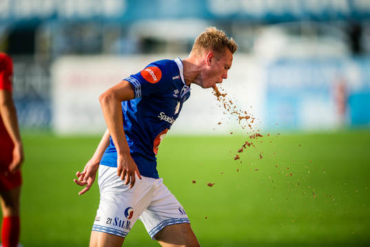 Torbjørn Lysaker Heggem of Ranheim throws up