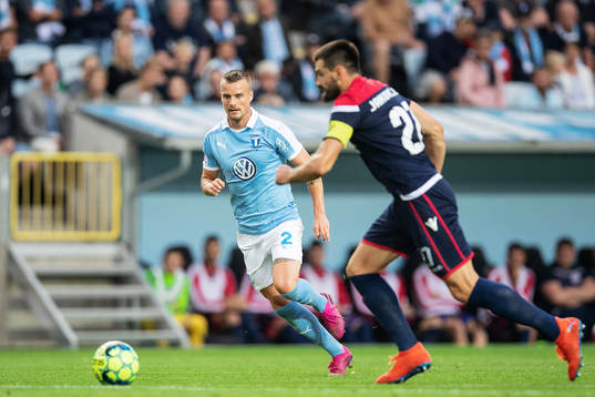 Eric Larsson of Malmö FF and Slobodan Jakovljevic of