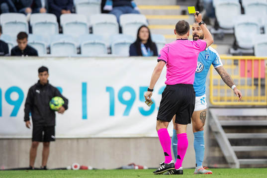 Guillermo Molins of Malmö FF is shown a yellow card by