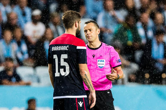 Tomislav Barbaric of Zrinjski and referee Stuart Attwell