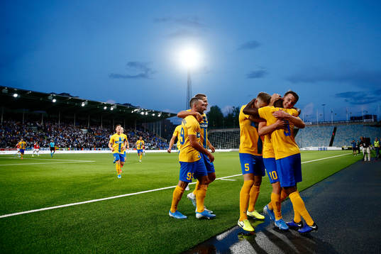 Simon Skrabb and Christoffer Nyman celebrate and hug Maic