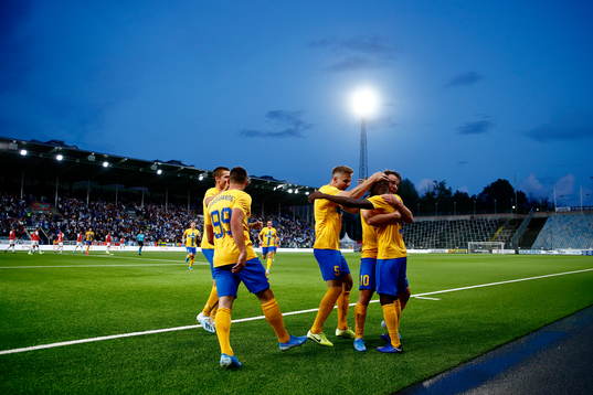 Simon Skrabb and Christoffer Nyman celebrate and hug Maic