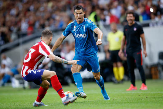 Kieran Trippier of Atletico Madrid and Cristiano Ronaldo of