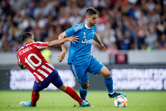 Angel Correa of Atletico Madrid and Emre Can of Juventus