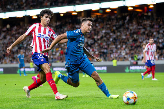 Manuel Sanchez of Atletico Madrid and Paulo Dybala of