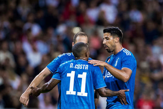 Sami Khedira of Juventus celebrates with Douglas Costa