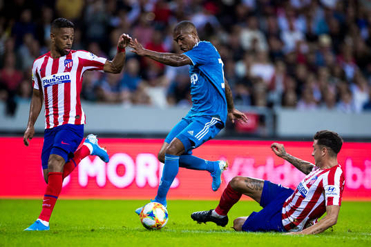 Renan Lodi of Atletico Madrid and Douglas Costa of Juventus