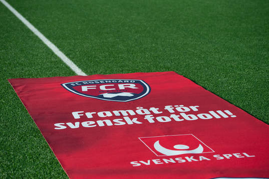 En matta från Svenska Spel på gräset
