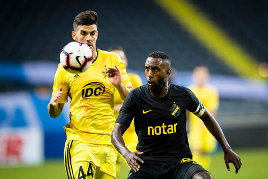 Henok Goitom of AIK battles for the ball with Andrej Lukic