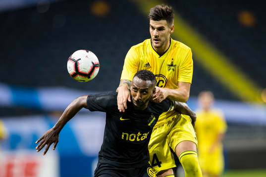 Henok Goitom of AIK battles for the ball with Andrej Lukic