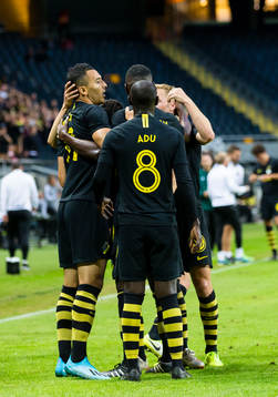 Nabil Bahoui of AIK celebrates with teammates