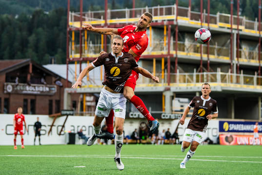 Quint Arie Jansen of Mjøndalen and Azar Karadas of Brann