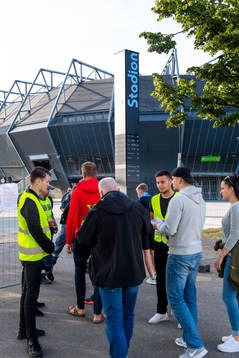 Visitors pass trough security checkpoints