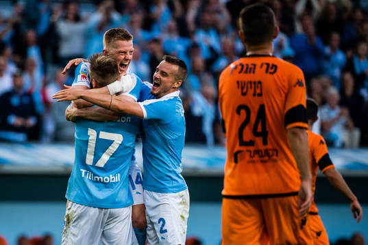 Anders Christiansen and Eric Larsson hugs Rasmus Bengtsson