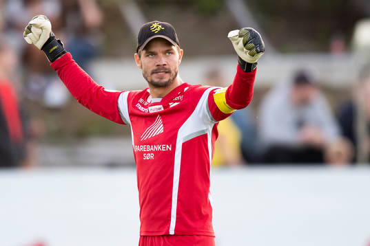 Goalkeeper Jonas Deumeland of Start celebrates