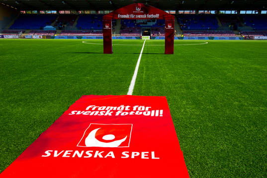 En matta med Svenska Spels logotyp